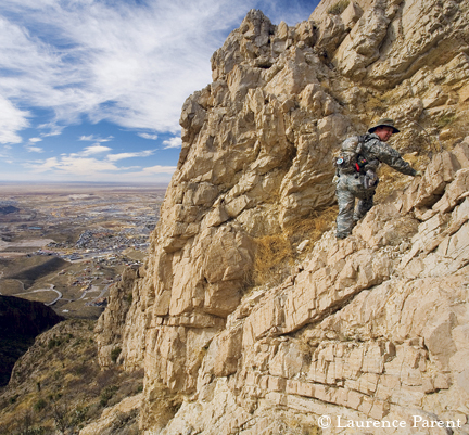 daring hiker on edge of cliff