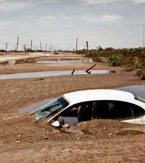 Car buried in mud from windows down
