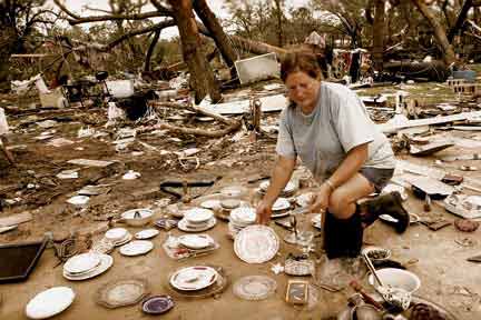 woman sorts through glassware