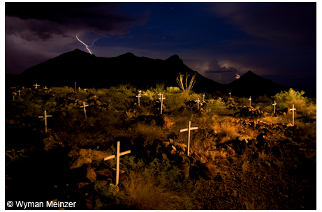Lightning strikes over The Three Sisters mountains