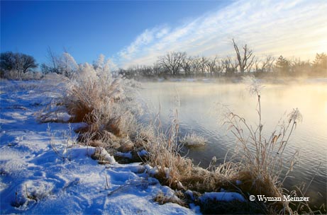 A winter fog rises from a Panhandle pond along the Canadian River north of Pampa.