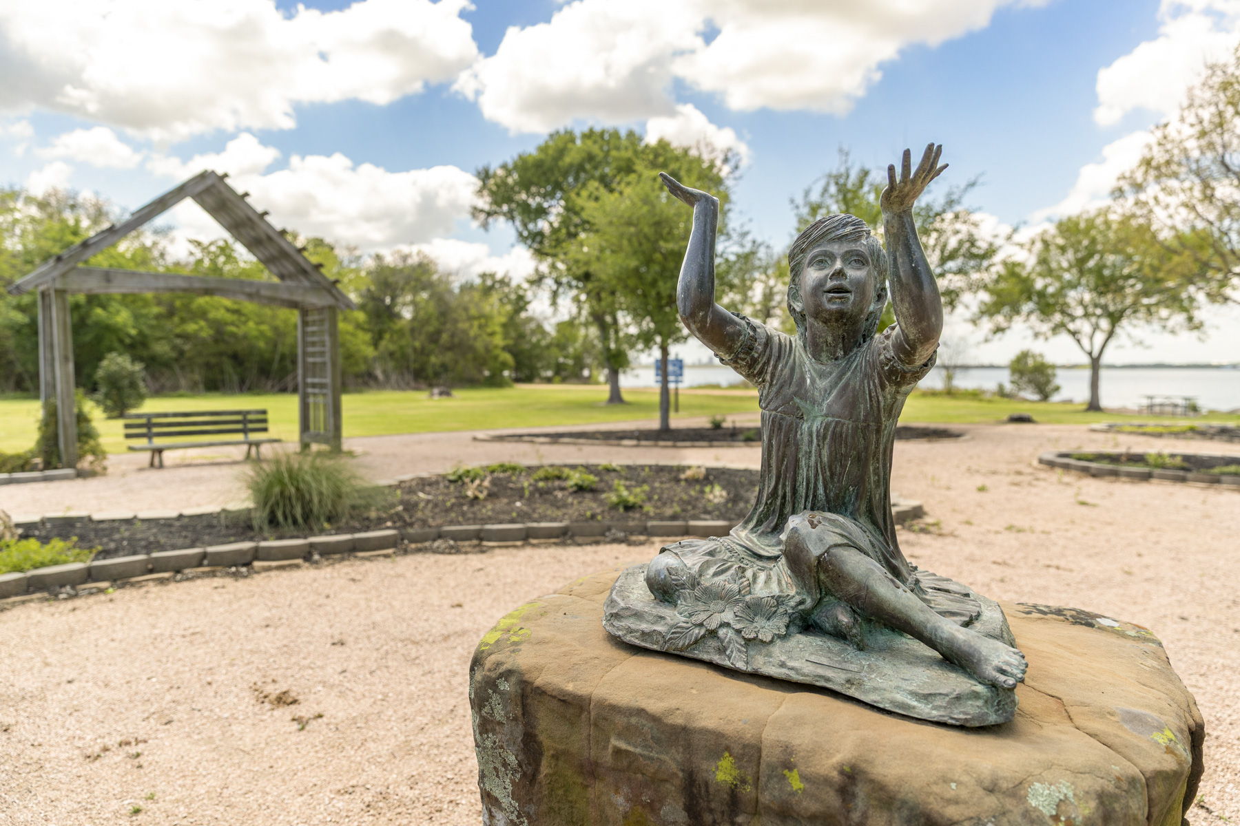 Statue of child with outstretched arms