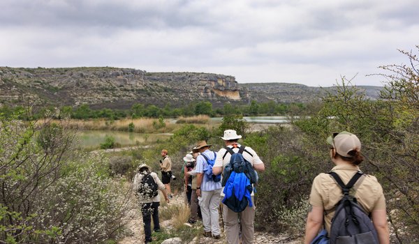 A group of people are hiking on a trail